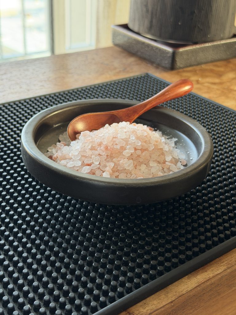 Pink salt and water representing electrolyte balance during a fast